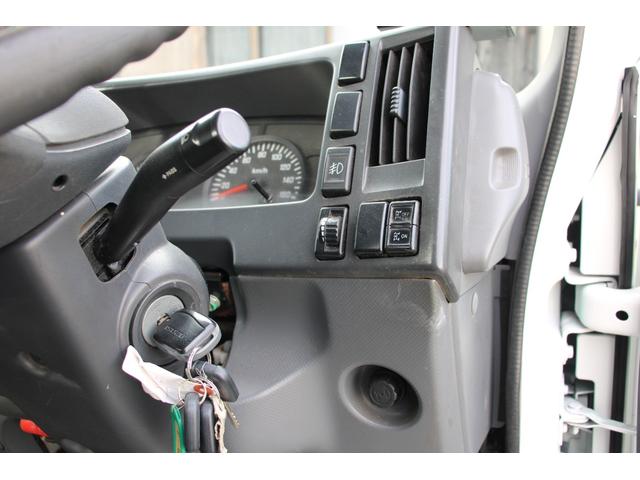 エルフトラック パッカー車/塵芥車 3.4t積載 6.5立米 回転式 新明和GR064-1634S2 巻込み式 連続積込 汚水タンク 電格ミラー サイドラダー 箱上キャリア スペアキー 車両総重量7995kg 荷台内寸4131-2051-1432(68枚目)