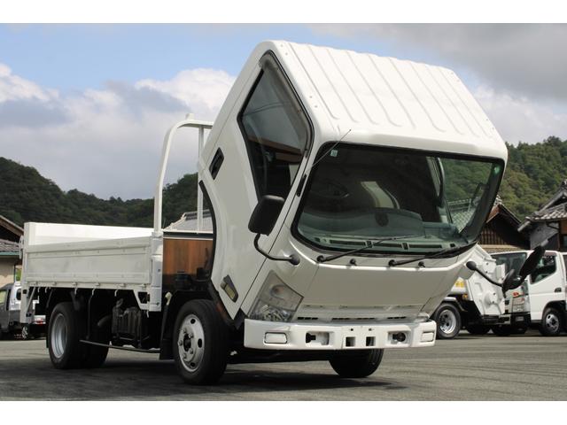 エルフトラック 平ボディ－２ｔ　パワーゲート（ＰＧ）　セミロング　全低床　☆１１尺☆トヨタパワーリフト☆荷床鉄板☆スペアキー☆電格ミラー☆車両総重量４８３５ｋｇ☆荷台内寸３５６９ｘ１８０２ｘ３７９☆ゲートテーブルサイズ６６３ｘ１６４２☆床地上高９０７（12枚目）
