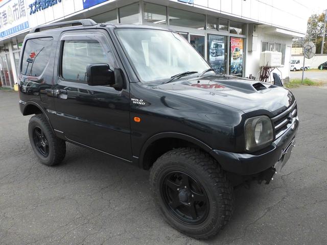 ジムニー ワイルドウインド リフトアップカスタム 社外前後バンパ 4WD キーレスエントリー シートヒーター AT ABS CD ルーフレール アルミホイール 衝突安全ボディ エアコン(3枚目)