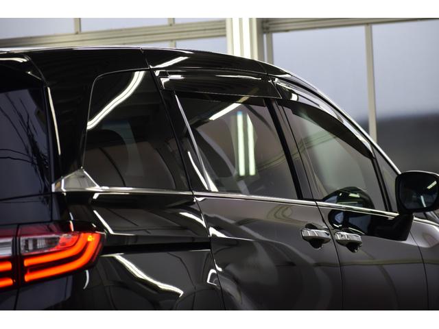 オデッセイ 2.4アブソルートEXホンダセンシング 4WD 4WD ハーフレザー/マルチビューモニター/フリップダウンモニター/パワーシート/大型アームレスト/ETC車載器/両側パワースライドドア/革巻きステアリング/ENKEI18インチアルミ(23枚目)