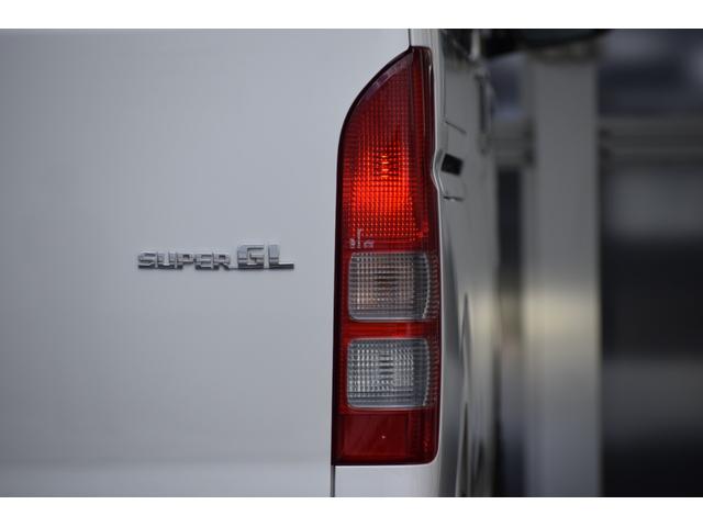 ハイエースバン ロングワイドスーパＧＬマルチロルトランスポタタイプＩＩ　４ＷＤ　３型モデル／モデリスタＭＲＴタイプ２／ロンリュームフロア／収納ＢＯＸ付フルトリム／ベッドキット／純正エンジンスターター社外アルミホイール／純正ＳＤナビＴＶ／バックカメラ／キセノン／ＬＥＤフォグ（27枚目）