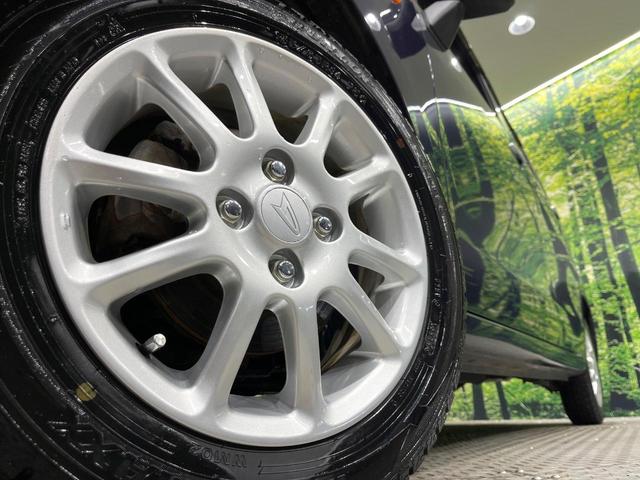 ムーヴ Ｘ　４ＷＤ　禁煙車　スマートキー　純正１４インチアルミ　オートライト　オートエアコン　ＣＤ　アイドリングストップ（13枚目）