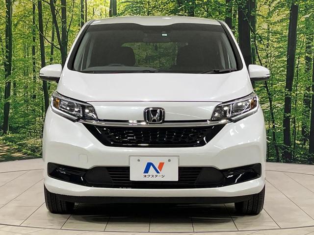 フリード Ｇ　本州仕入れ　４ＷＤ　寒冷地仕様　両側電動ドア　９インチ純正ＳＤナビ　バックカメラ　寒冷地仕様　ホンダセンシング　レーダークルーズ　禁煙車　ドラレコ　コーナーセンサー　スマートキー　ＬＥＤヘッド　ＥＴＣ（15枚目）