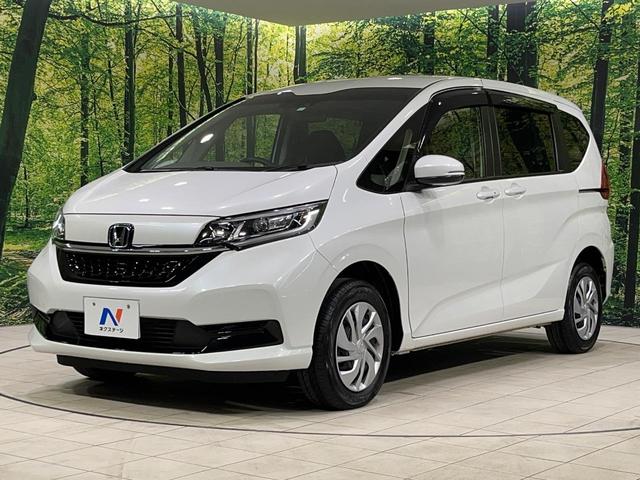 フリード Ｇ　本州仕入れ　４ＷＤ　寒冷地仕様　両側電動ドア　９インチ純正ＳＤナビ　バックカメラ　寒冷地仕様　ホンダセンシング　レーダークルーズ　禁煙車　ドラレコ　コーナーセンサー　スマートキー　ＬＥＤヘッド　ＥＴＣ（26枚目）