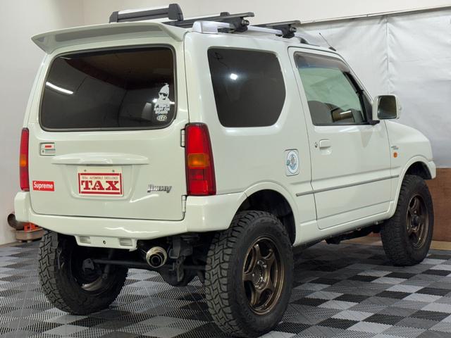 ジムニー ワイルドウインド 4WD 社外前後バンパー 社外16インチアルミ オープンカントリー 社外マフラー ルーフレール シートヒーター リフトアップ 寒冷地仕様 バックカメラ(2枚目)