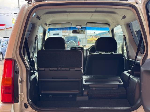 ジムニー ワイルドウインド 4WD 社外前後バンパー 社外16インチアルミ オープンカントリー 社外マフラー ルーフレール シートヒーター リフトアップ 寒冷地仕様 バックカメラ(8枚目)