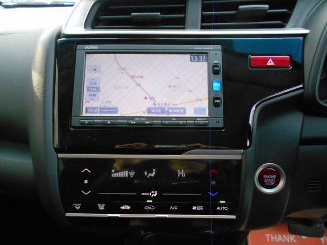 フィット １３Ｇ・Ｆパッケージ　純正ナビ　ＴＶ　Ｂｌｕｅｔｏｏｔｈ　ドライブレコーダー　ＥＴＣ　バックカメラ　衝突被害軽減システム　スマートキー　電動格納ミラー　ＣＶＴ　盗難防止システム　衝突安全ボディ　ＥＳＣ（5枚目）