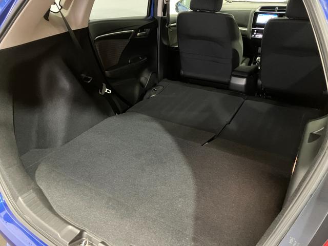 フィットハイブリッド Ｆ　４ＷＤ　寒冷地仕様　ＥＴＣ　バックカメラ　社外ナビ　ワンセグＴＶ　　Ｂｌｕｅｔｏｏｔｈ接続　ハンズフリー　障害物接近アラート　ＬＥＤヘッド・フォグライト　横滑り防止（52枚目）