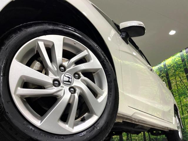 フィット 13G・Sパッケージ 4WD 純正ナビ バックカメラ 寒冷地仕様 衝突軽減 禁煙車 ドラレコ LEDヘッド ETC クルコン 純正15インチAW オートライト オートエアコン アイドリングストップ ステアリングスイッチ(14枚目)