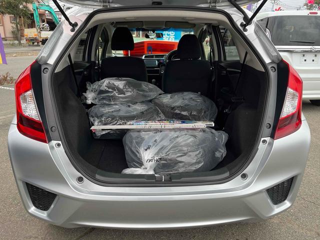 フィット 13G・Fパッケージ 4WD ETC バックカメラ ナビ アルミホイール スマートキー アイドリングストップ CVT 盗難防止システム 衝突安全ボディ ABS ESC エアコン パワーステアリング パワーウィンドウ(15枚目)