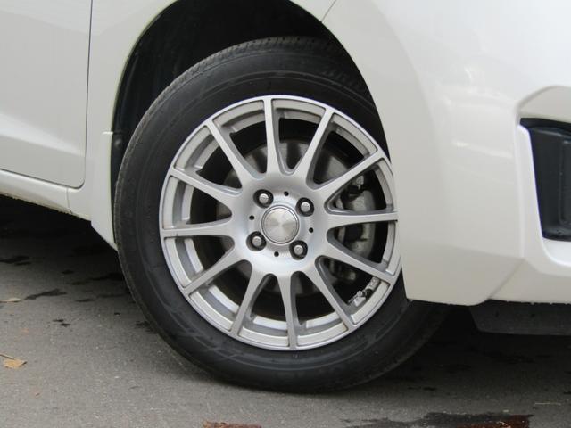 フィット １３Ｇ・Ｌパッケージ　純正ナビ・ＣＤ・ＵＳＢ接続・Ｂｌｕｅｔｏｏｔｈ接続・バックカメラ・純正フロアマット・サイドカーテンエアバック・オートエアコン・オートヘッドライト・社外アルミホイール４本・純性スチールホイール４本（58枚目）