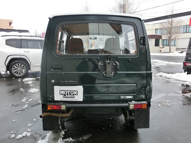 ジムニー ワイルドウインドリミテッド　タニグチ前後バンパー・タニグチ２ＵＰシャックル公認・ＣＤ・グリーンツートン・革調シートカバー・革調内張・ウッドハンドル・夏ブロックタイヤ付純正ホイール・冬２０２４製ＢＳスタッドレス・クリスタルライト（12枚目）