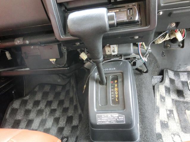 ジムニー ワイルドウインドリミテッド　タニグチ前後バンパー・タニグチ２ＵＰシャックル公認・ＣＤ・グリーンツートン・革調シートカバー・革調内張・ウッドハンドル・夏ブロックタイヤ付純正ホイール・冬２０２４製ＢＳスタッドレス・クリスタルライト（17枚目）