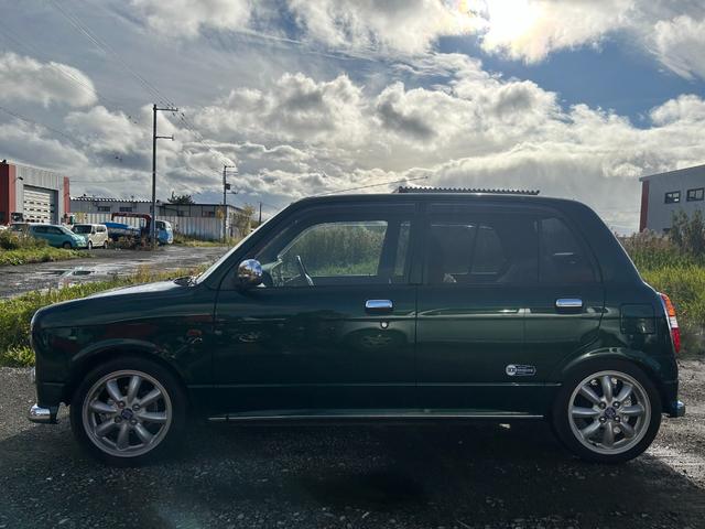 ミラジーノ ミニライトスペシャル　１５インチ　ミニライトホイール　ローダウン　ダウンサス社外センターマフラー　２本出し　バックカメラ　タイミングベルト交換済　夏冬タイヤ　ナビＴＶ　フォグランプ　革調シート　４ＷＤ（9枚目）