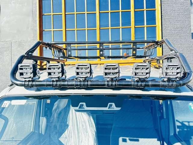 スーパーキャリイ Xリミテッド 届出済未使用車/EN-リフトアップカスタム/2.2インチリフトアップ/強化コイル/マッドスターATタイヤ/PPXアルミ/しし狩りバンパー/ルーフラックバー/LEDワークライト/LEDテール/荷台マット(12枚目)