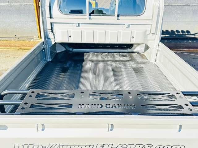 スーパーキャリイ Xリミテッド 届出済未使用車/EN-リフトアップカスタム/2.2インチリフトアップ/強化コイル/マッドスターATタイヤ/PPXアルミ/しし狩りバンパー/ルーフラックバー/LEDワークライト/LEDテール/荷台マット(19枚目)