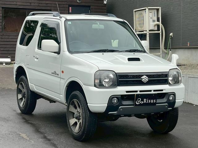 ジムニー ランドベンチャー　４ＷＤ　バックカメラ　ナビ　アルミホイール　キーレスエントリー　電動格納ミラー　シートヒーター　ＡＴ　衝突安全ボディ　ＡＢＳ　エアコン　パワーステアリング　パワーウィンドウ　運転席エアバッグ（11枚目）