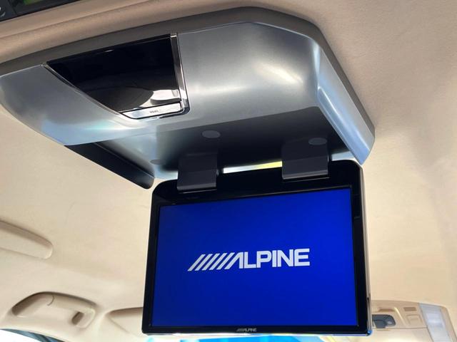 アルファードハイブリッド G 4WD 禁煙車 両側電動スライドドア フリップダウンモニター HDDナビ バックカメラ HIDヘッドライト HIDフロントフォグ スマートキー 前席パワーシート 電動オットマン ビルトインETC(3枚目)