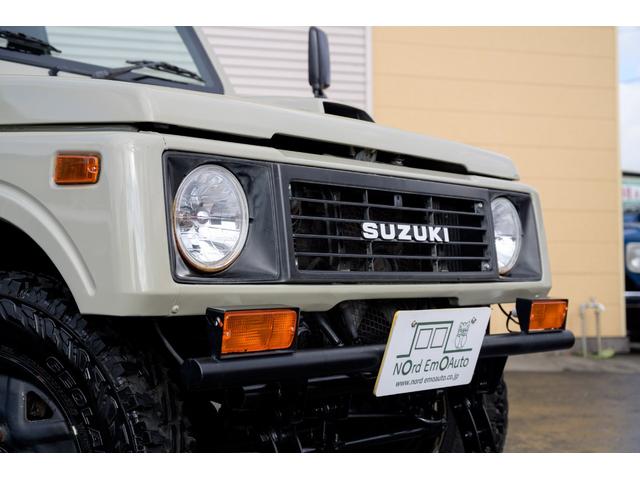 ジムニー 　／オールペイントデザートカーキ／２インチアップ／最終５型モデル／クラシックグリル／ジオランダーマッドタイヤ／前後ステンレスバンパー／クリスタルヘッドライト／ドライブレコーダー／シートカバー／エアコン／（9枚目）