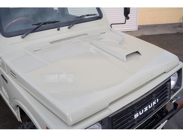 ジムニー 　／オールペイントデザートカーキ／２インチアップ／最終５型モデル／クラシックグリル／ジオランダーマッドタイヤ／前後ステンレスバンパー／クリスタルヘッドライト／ドライブレコーダー／シートカバー／エアコン／（11枚目）