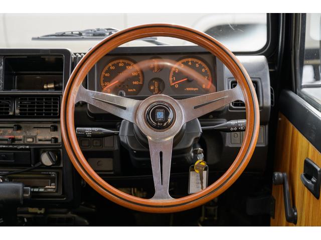 ジムニー ＨＣ　／本州東海仕入れ／新品ジオランダーマッドタイヤ／新品ＪＢ６４ＸＣアルミホイール／室内ウッド仕様／メッキグリル／クリアレンズ／前後ステンレスフロントバンパー／ナルディウッドステアリング／シートカバー（23枚目）