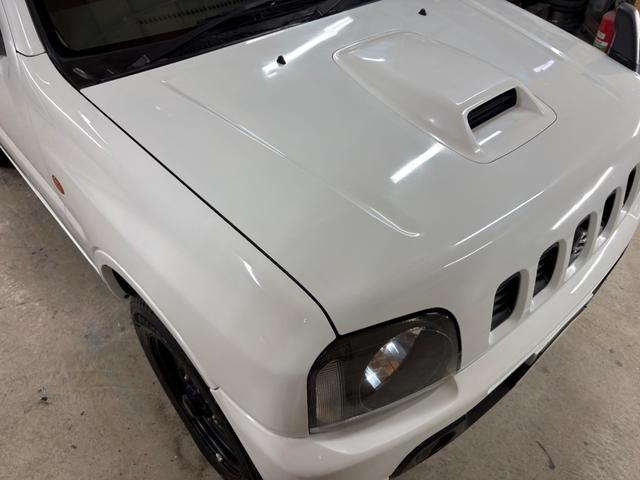 ジムニー XG 4WD/本州産/3型/5MT/ナビ/TV/下防錆済/ABS/ETC/キーレス/スタットレスタイヤ装着/純正ゴムマット/ドアバイザー/背面タイヤカバー/ライトコーティング/エアコン//検2年/(12枚目)