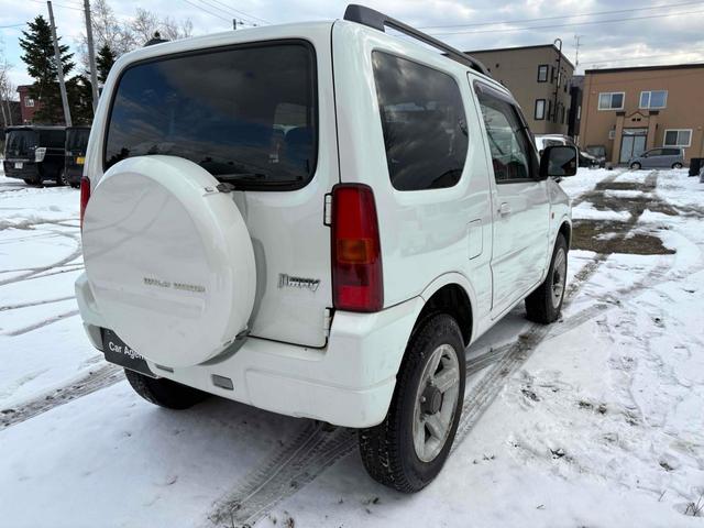 ジムニー ワイルドウインド 4WD フルセグTV ブルートゥース対応 キーレスエントリー 電動格納ミラー AT ABS ルーフレール アルミホイール 衝突安全ボディ エアコン パワーウィンドウ(11枚目)