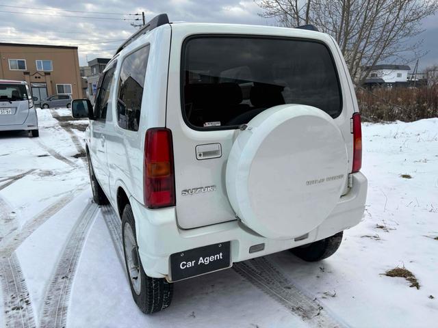 ジムニー ワイルドウインド 4WD フルセグTV ブルートゥース対応 キーレスエントリー 電動格納ミラー AT ABS ルーフレール アルミホイール 衝突安全ボディ エアコン パワーウィンドウ(12枚目)