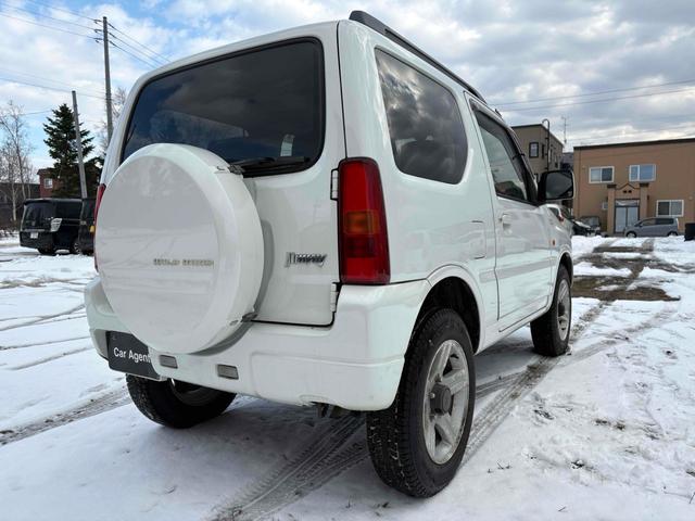 ジムニー ワイルドウインド 4WD フルセグTV ブルートゥース対応 キーレスエントリー 電動格納ミラー AT ABS ルーフレール アルミホイール 衝突安全ボディ エアコン パワーウィンドウ(14枚目)