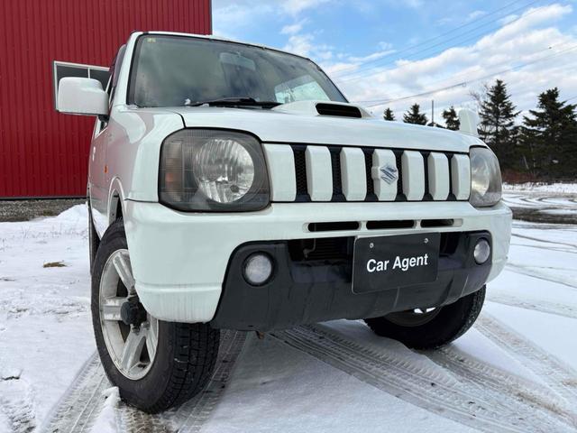 ジムニー ワイルドウインド 4WD フルセグTV ブルートゥース対応 キーレスエントリー 電動格納ミラー AT ABS ルーフレール アルミホイール 衝突安全ボディ エアコン パワーウィンドウ(21枚目)