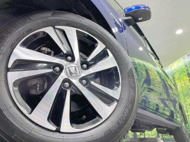 フリードハイブリッド ハイブリッド・Ｇホンダセンシング　純正９型ナビ　バックカメラ　両側電動ドア　シートヒーター　寒冷地仕様　ＬＥＤヘッド　ドラレコ　ＥＴＣ　レーダークルーズ　コーナーセンサー　純正１５ＡＷ　オートエアコン　ステアリングスイッチ　横滑り防止（14枚目）