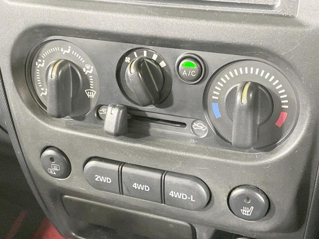 ジムニー ワイルドウインド　４ＷＤ　禁煙車　ターボ　シートヒーター　オーディオ　ルーフレール　純正１６ＡＷ　電動格納ミラー　ヘッドライトレベライザー　トラクションコントロール　衝突安全ボディ（5枚目）