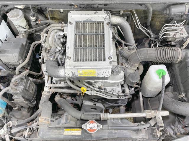 ジムニー ワイルドウインド　４ＷＤ　禁煙車　ターボ　シートヒーター　オーディオ　ルーフレール　純正１６ＡＷ　電動格納ミラー　ヘッドライトレベライザー　トラクションコントロール　衝突安全ボディ（19枚目）