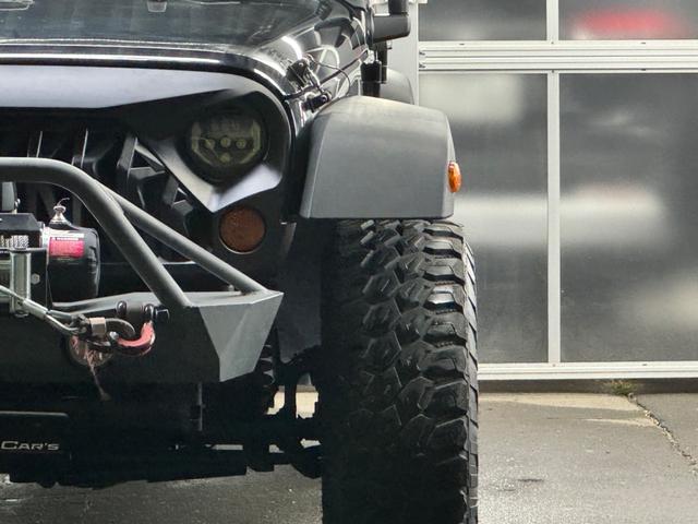 ジープ・ラングラーアンリミテッド スポーツ リフトアップ/マッドタイヤ/社外バンパー/社外グリル/社外ヘッドライト/サイドマーカー/サイドステップ/ルーフラック/テールガード/アルパインフローティングナビTV/バックカメラ/ETC車載器(9枚目)