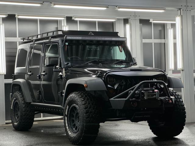 ジープ・ラングラーアンリミテッド スポーツ リフトアップ/マッドタイヤ/社外バンパー/社外グリル/社外ヘッドライト/サイドマーカー/サイドステップ/ルーフラック/テールガード/アルパインフローティングナビTV/バックカメラ/ETC車載器(10枚目)