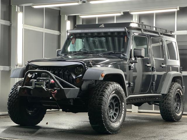 ジープ・ラングラーアンリミテッド スポーツ リフトアップ/マッドタイヤ/社外バンパー/社外グリル/社外ヘッドライト/サイドマーカー/サイドステップ/ルーフラック/テールガード/アルパインフローティングナビTV/バックカメラ/ETC車載器(11枚目)