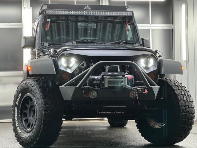 ジープ・ラングラーアンリミテッド スポーツ リフトアップ/マッドタイヤ/社外バンパー/社外グリル/社外ヘッドライト/サイドマーカー/サイドステップ/ルーフラック/テールガード/アルパインフローティングナビTV/バックカメラ/ETC車載器(12枚目)