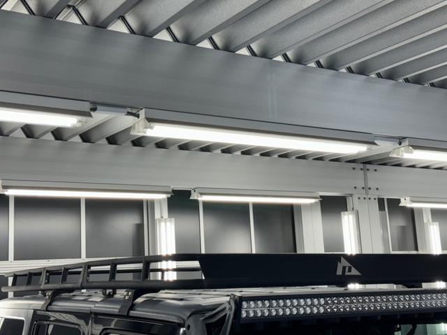 ジープ・ラングラーアンリミテッド スポーツ リフトアップ/マッドタイヤ/社外バンパー/社外グリル/社外ヘッドライト/サイドマーカー/サイドステップ/ルーフラック/テールガード/アルパインフローティングナビTV/バックカメラ/ETC車載器(14枚目)