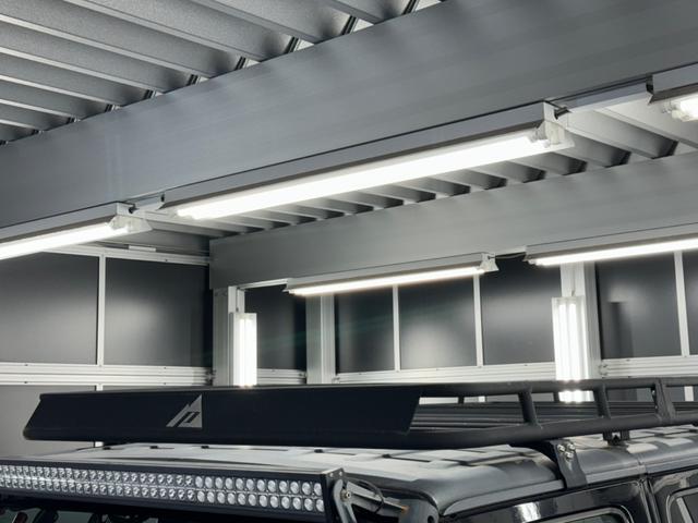 ジープ・ラングラーアンリミテッド スポーツ リフトアップ/マッドタイヤ/社外バンパー/社外グリル/社外ヘッドライト/サイドマーカー/サイドステップ/ルーフラック/テールガード/アルパインフローティングナビTV/バックカメラ/ETC車載器(15枚目)