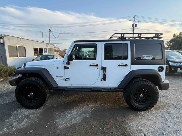 ジープ・ラングラーアンリミテッド スポーツ　４ＷＤ　オートクルーズコントロール　ＡＴ　盗難防止システム　Ｂｌｕｅｔｏｏｔｈ　ＡＢＳ　エアコン　パワーウィンドウ（18枚目）