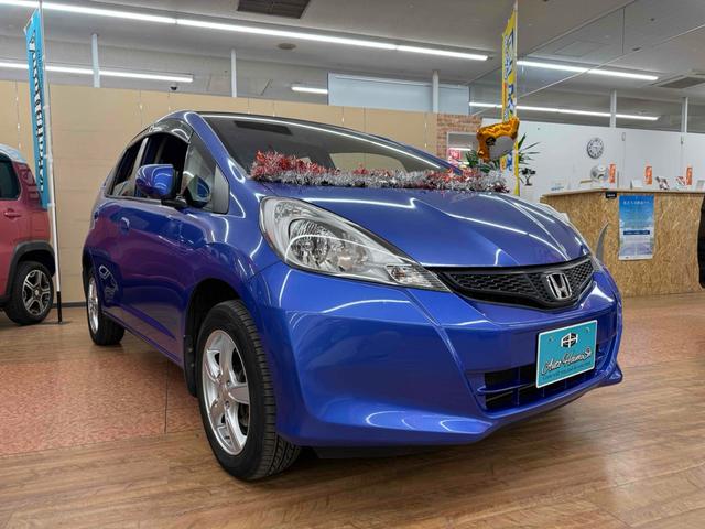 フィット Ｌ　４ＷＤ　ＥＴＣ　アルミホイール　ＨＩＤ　スマートキー　電動格納ミラー　ＡＴ　盗難防止システム　衝突安全ボディ　ＡＢＳ　ＣＤ　ミュージックプレイヤー接続可　エアコン　パワーステアリング　パワーウィンドウ（14枚目）