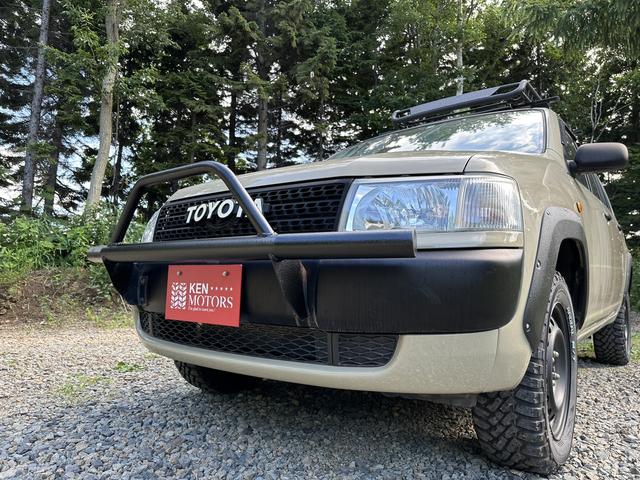 ＤＸ　４ＷＤ　ＥＴＣ　ナビ　電動格納ミラー　ＡＴ　ＣＤ　ＭＤ　ミュージックプレイヤー接続可　エアコン　パワーウィンドウ　運転席エアバッグ　助手席エアバッグ　オリジナル全塗装ベージュ　リフトＵＰ　ルーフラック(25枚目)