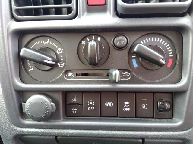 スーパーキャリイ Ｘ　パートタイム４ＷＤ　衝突軽減ブレーキ　キーレスキー　オートＬＥＤ　アイドリングＳＴＯＰ　ＶＳＣ　ＡＢＳ　Ａライト　禁煙　ＬＥＤライト　エアコン　パワステ　ＰＳ　前席ＰＷ　運転席エアバック　幌キット（19枚目）