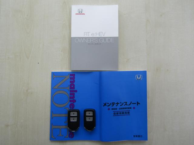 フィット e:HEVベーシック 4WD リヤカメラ イクリプスナビBT コンフォートビューPKG/ミラーヒーター/前窓熱線 センシング/ブレーキ/歩行者・車線検出操舵支援/先行発進/渋滞追従/誤発進/パーキングセンサー/標識認識 フルLEDヘッドライト スマキー ドラレコ(27枚目)