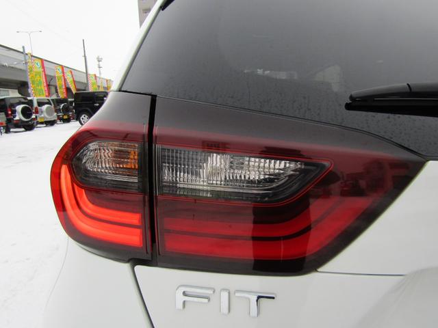 フィット e:HEVベーシック 4WD リヤカメラ イクリプスナビBT コンフォートビューPKG/ミラーヒーター/前窓熱線 センシング/ブレーキ/歩行者・車線検出操舵支援/先行発進/渋滞追従/誤発進/パーキングセンサー/標識認識 フルLEDヘッドライト スマキー ドラレコ(49枚目)