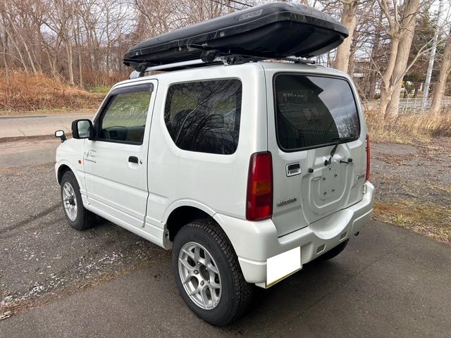 ジムニー ＦＩＳフリースタイルワールドカップリミテッド　４ＷＤ　ナビ　テレビ　ＥＴＣ　ターボタイマー　夏冬タイヤ　スペアキー　曇止め用ヒーター機能付ドアミラー　シートヒーター　ルーフキャリア（10枚目）