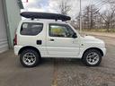 ジムニー ＦＩＳフリースタイルワールドカップリミテッド　４ＷＤ　ナビ　テレビ　ＥＴＣ　ターボタイマー　夏冬タイヤ　スペアキー　曇止め用ヒーター機能付ドアミラー　シートヒーター　ルーフキャリア（4枚目）