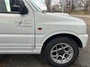 ジムニー ＦＩＳフリースタイルワールドカップリミテッド　４ＷＤ　ナビ　テレビ　ＥＴＣ　ターボタイマー　夏冬タイヤ　スペアキー　曇止め用ヒーター機能付ドアミラー　シートヒーター　ルーフキャリア（5枚目）