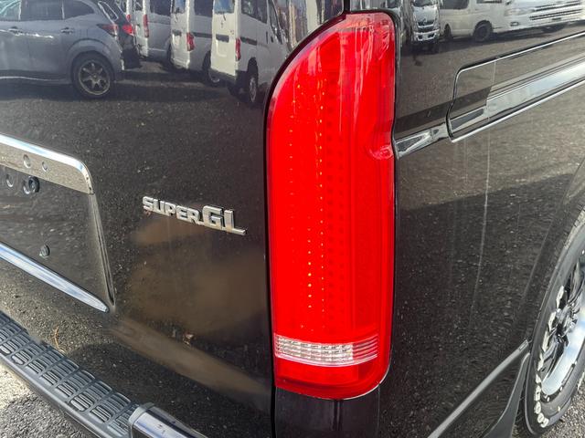 レジアスエースバン スーパーGL ダークプライム スマートキー プッシュスタート 社外SDナビ バックカメラ ETC 両側パワースライドドア LEDヘッドライト 社外Fリップスポイラー 社外テール ベッドキット(16枚目)