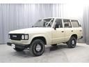ランドクルーザー60 VX 丸目ロールーフ ディーゼルターボ オートマ マットベージュ塗装 地デジナビ バックカメラ ドラレコ キーレス ウッドハンドル シートカバー ヒッチ オープンカントリーRTタイヤ 本州仕入 1ナンバー 中古車画像_2